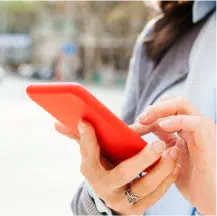 Woman Checking Her Phone With Red Case