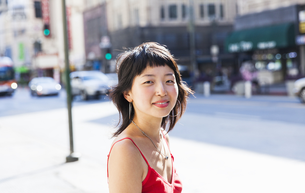 Young woman looking at camera smiling