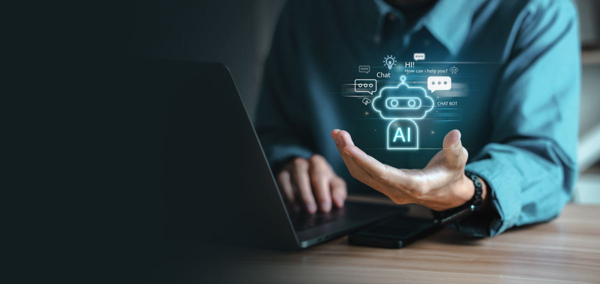 Person working at laptop interacting with artificial intelligence