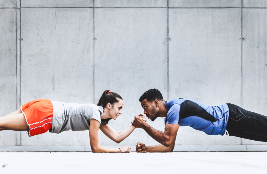 a man and a woman are doing plank exercises together