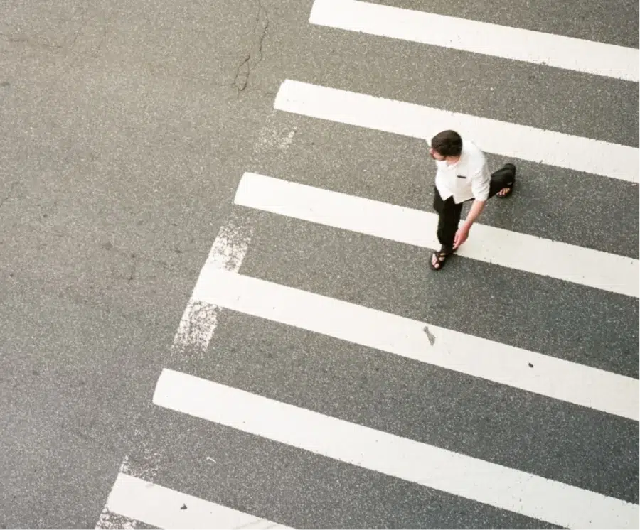 Guy crossing the road