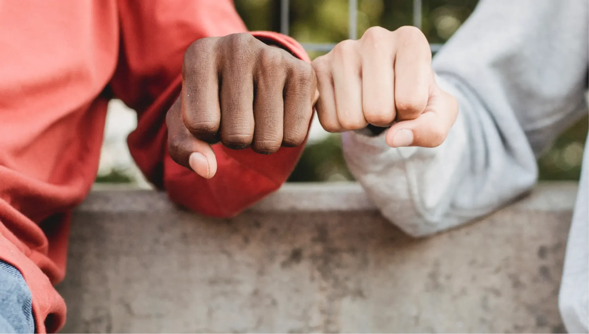 Two people bumping fists.