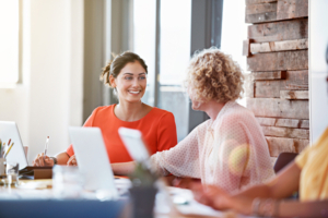 Shot of two businesswomen having a discussion in an office